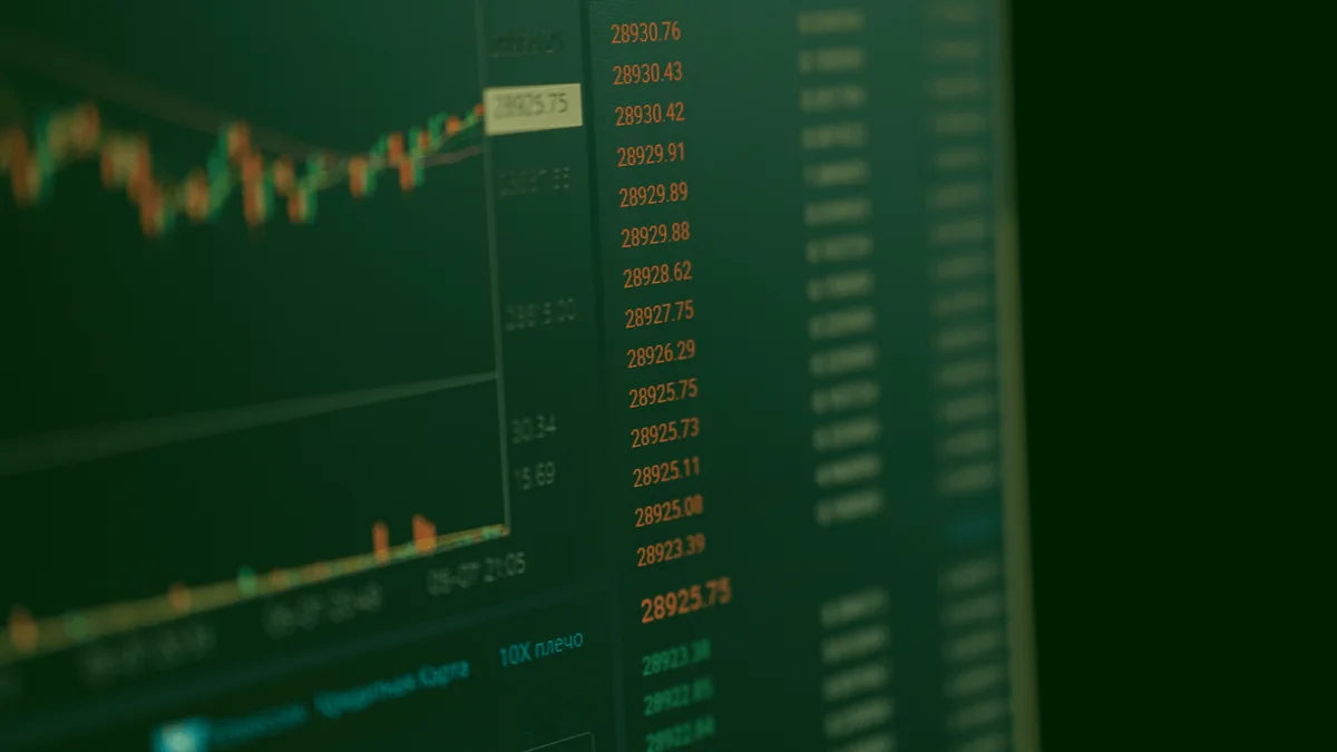 Valor de mercado: monitor com gráficos e cotações para análise de empresas